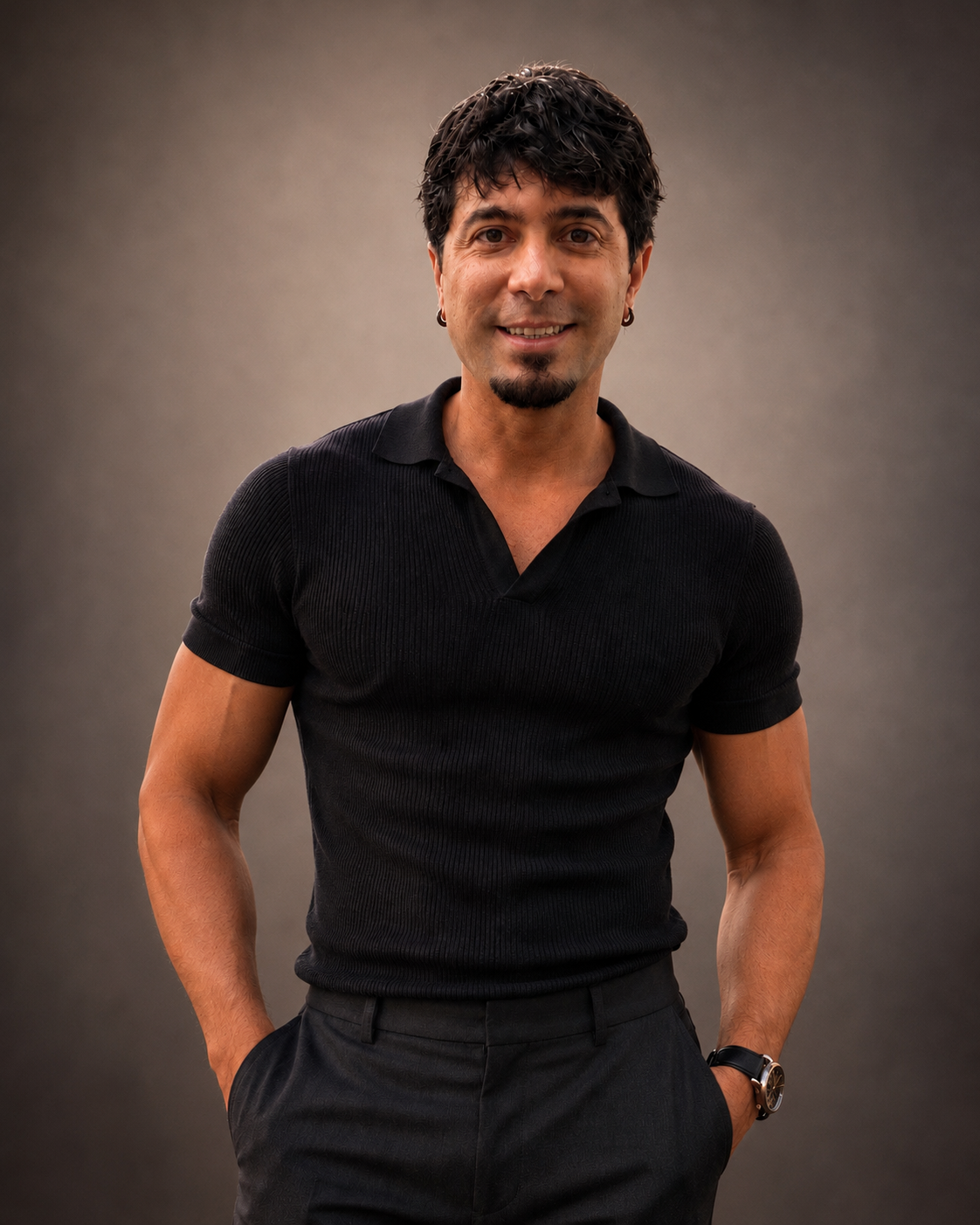 Fabiano Umbrus standing in a black polo shirt against a neutral gray background.